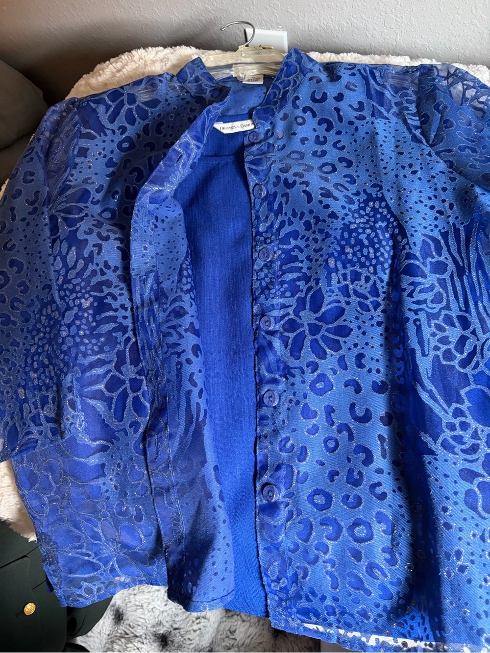 Draper and Damon’s deep blue sheer floral top with tank underneath